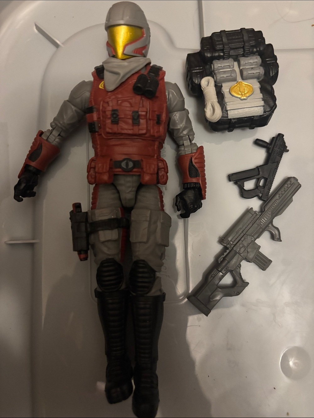 Officer, notable for its red torso and grey limbs.
